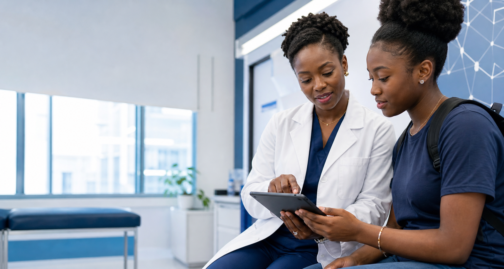 ATU clinician reviewing health information with a university student